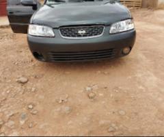 A second hand used nissan sentra -2003  GXE sedan,  4D model (actually handled by woman) for sale. - 1